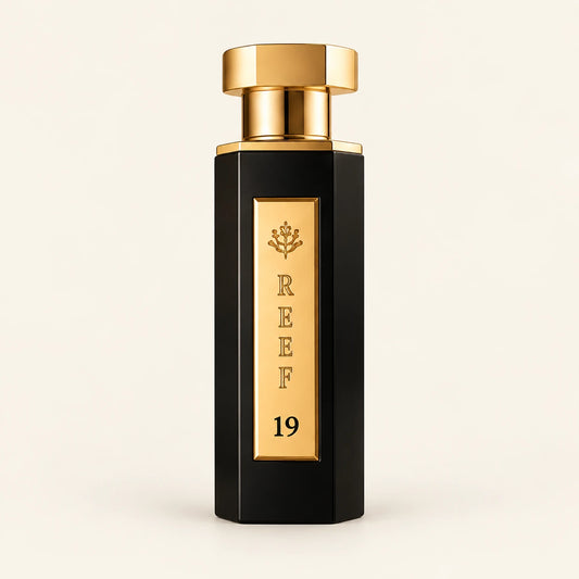 REEF 19 Eau de Parfum 100ml on a plain ivory studio background