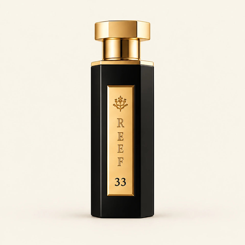 REEF 33 Black Eau de Parfum 100ml on a plain ivory studio background